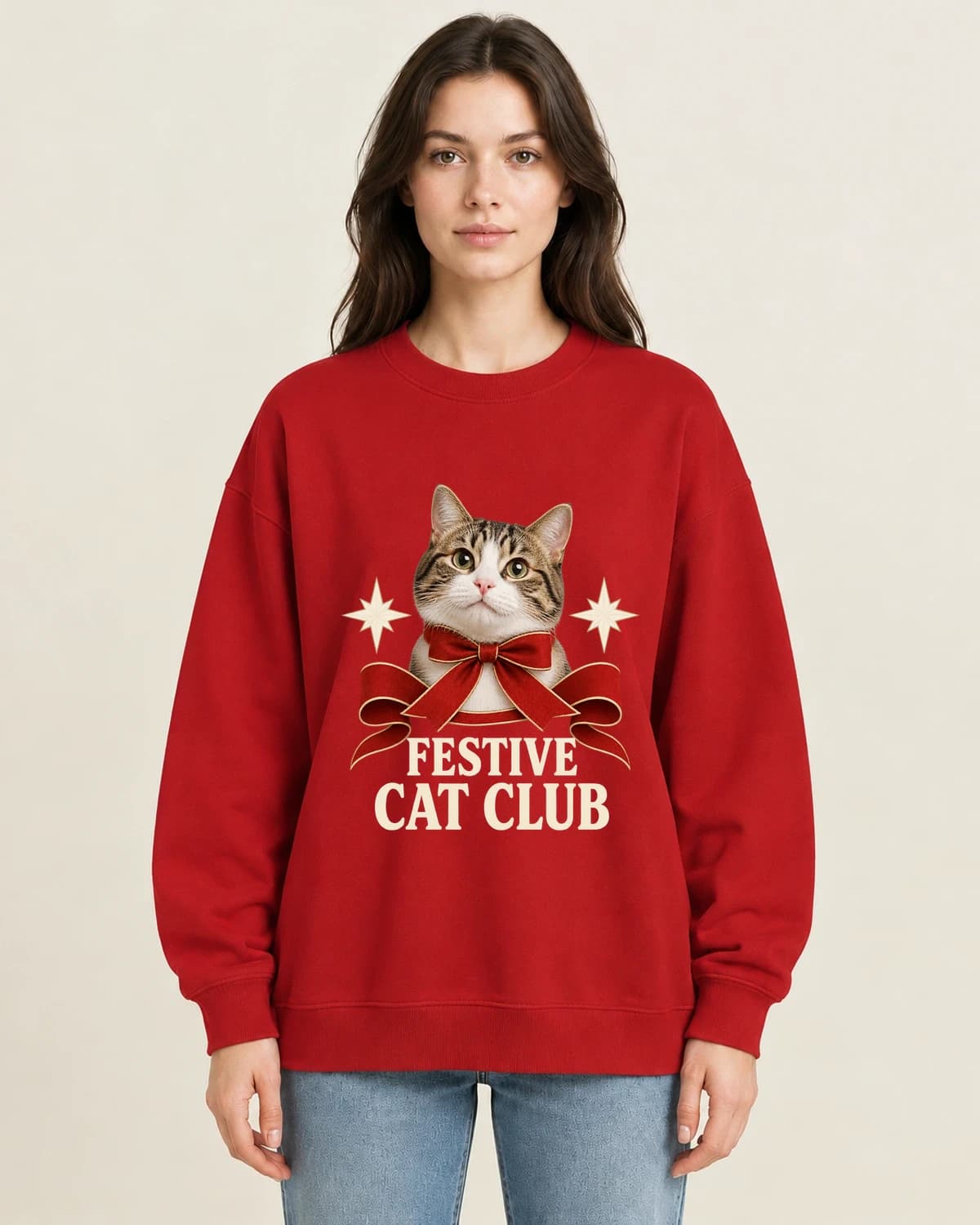 The personal kind of festive: Christmas Cat Ribbon Club on women's crewneck; illustrative styling